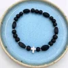 By Gabay, Armbånd med sølvkors, glas- og træperler